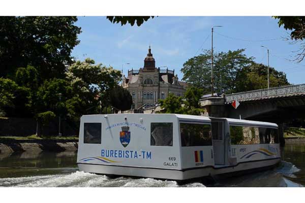 A vaporetto* travels on the Bega Canal in Timisoara